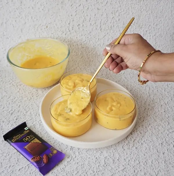 Mango Mousse with Dark Chocolate Crunch - Pour the mousse into small dessert cups