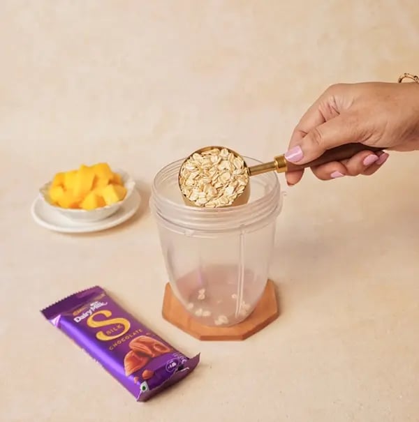 Mango Oats Smoothie with Cadbury Silk Crunch-Start by adding oats