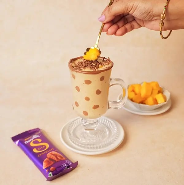 Mango Oats Smoothie with Cadbury Silk Crunch-Finish by garnishing with shaved Silk chocolate