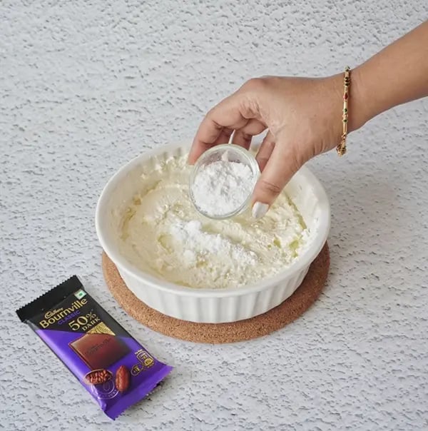 Mango Shrikhand with Bournville Chocolate chips-Add in powdered sugar