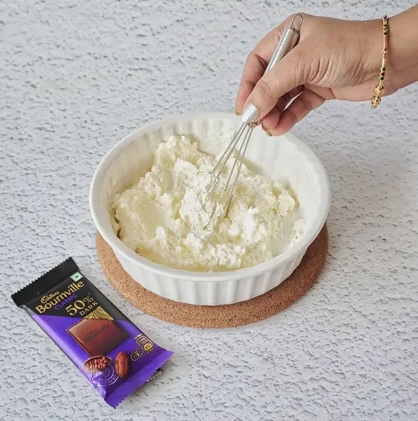 Mango Shrikhand with Bournville Chocolate chips-Whisk the hung curd