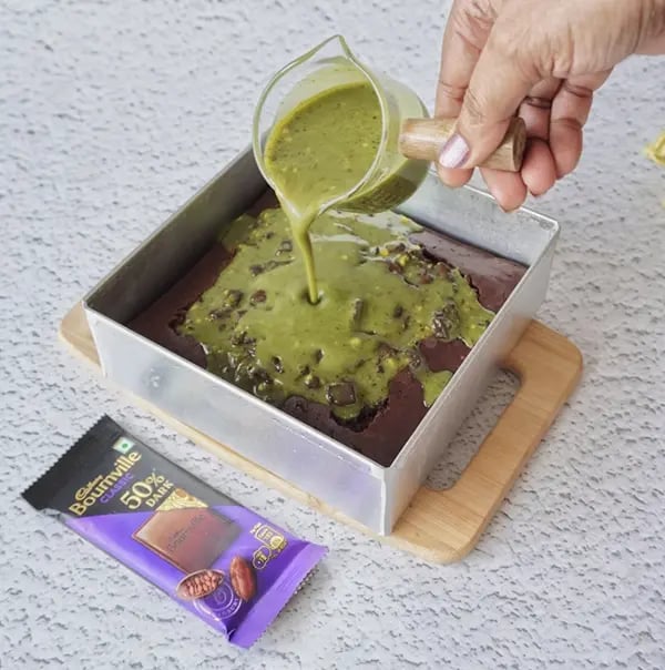 Mini Cream Brownies with Pistachio And Cadbury Bournville - Pour the pistachio mixture