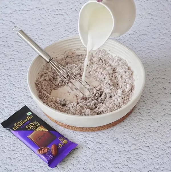 Mini Cream Brownies with Pistachio And Cadbury Bournville - Add milk to make a smooth brownie batter