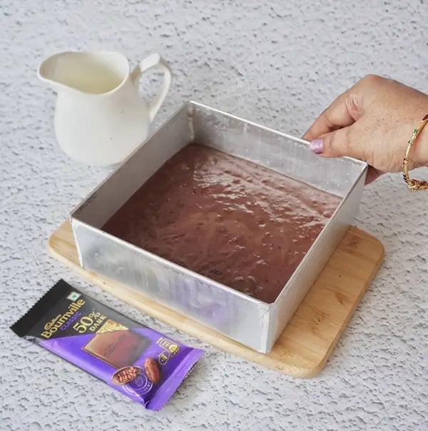 Mini Cream Brownies with Pistachio And Cadbury Bournville - Pour into a lined tin