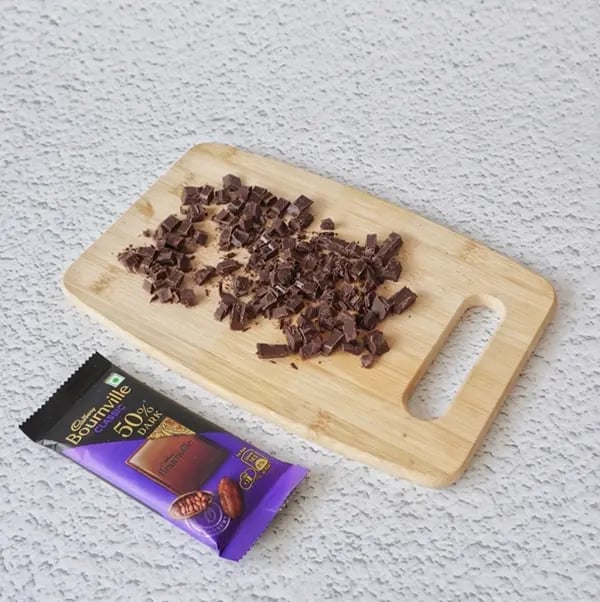 Mini Cream Brownies with Pistachio And Cadbury Bournville - Chop the Bournville chocolate