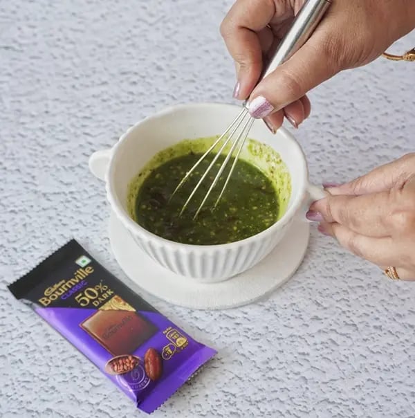 Mini Cream Brownies with Pistachio And Cadbury Bournville - Mix the pistachio with chocolate chips gently