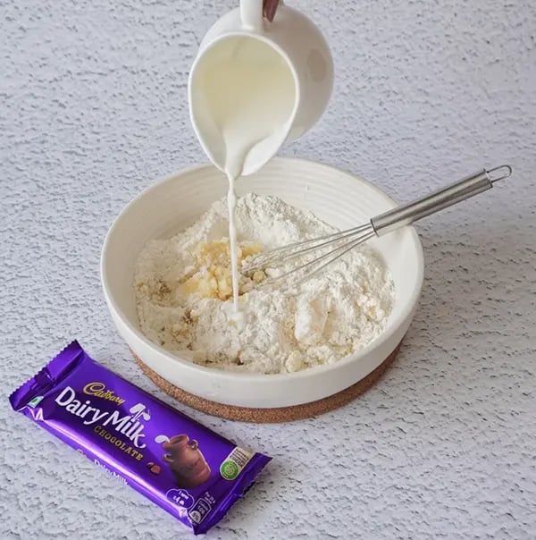 Mini Egg Nest Sugar Cookies with Dairy Milk And Gems-Add milk to make a smooth dough