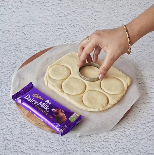 Mini Egg Nest Sugar Cookies with Dairy Milk And Gems-Roll out the dough on a floured surface