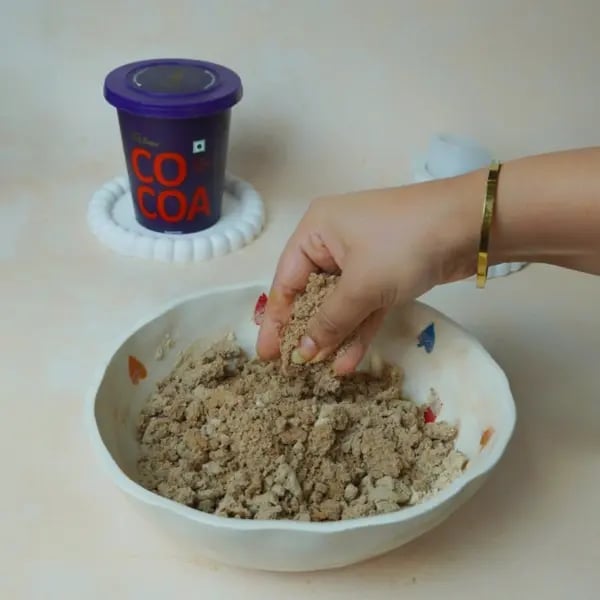 Mohanthal Recipe With Cocoa And Gems: Add A Fun Twist To This Gujarati Diwali Mithai - Rubbing Mixture Palms