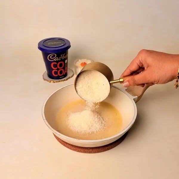 Narkel Naru With Cadbury Cocoa Powder: A Classic Bengali Coconutty Treat With A Chocolatey Twist - Sautéing Grated Coconut