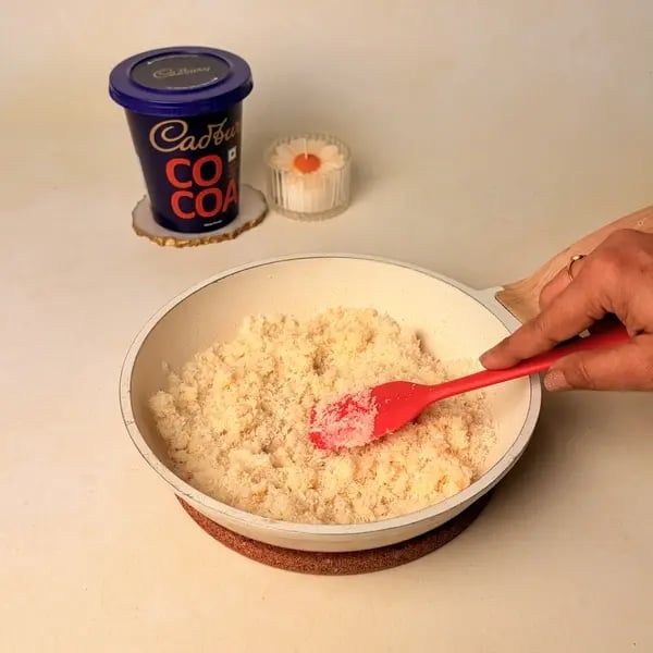 Narkel Naru With Cadbury Cocoa Powder: A Classic Bengali Coconutty Treat With A Chocolatey Twist - Mixture Leaving Pan Sides