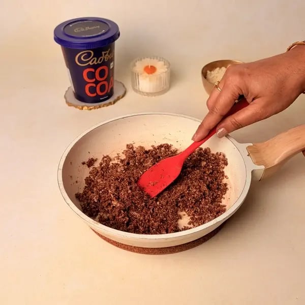 Narkel Naru With Cadbury Cocoa Powder: A Classic Bengali Coconutty Treat With A Chocolatey Twist - Mixing Cocoa Coconut