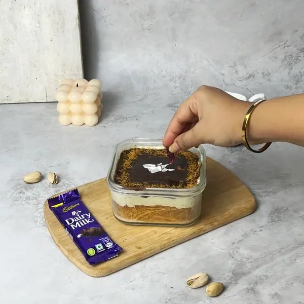 No-Bake Kunafa Dairymilk Cheesecake - Pistachios And Rose Petals