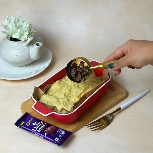 No-Fuss Banana Dairy Milk Chocolate Cake - Folding Chocolate Chunks