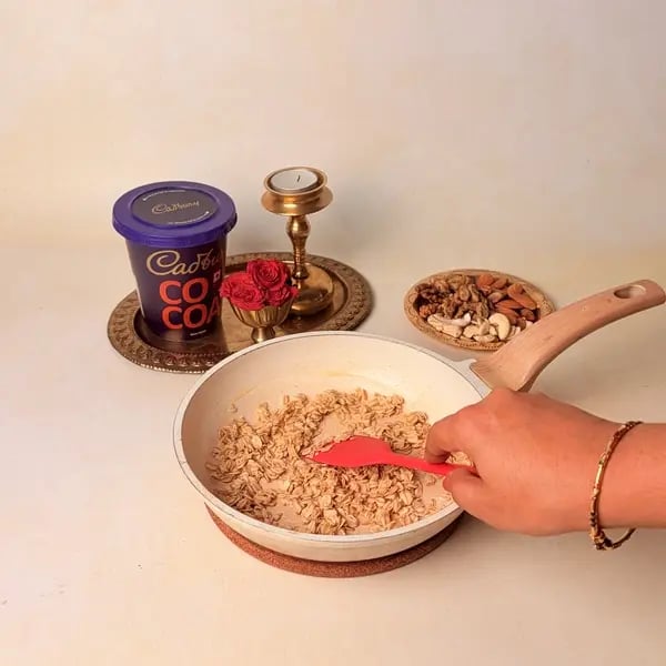 Oats Modak Recipe For Ganpati Bappa With Dry Fruits And Cadbury Cocoa Powder Twist - Roasting Oats In Pan