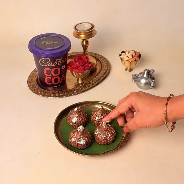 Oats Modak Recipe For Ganpati Bappa With Dry Fruits And Cadbury Cocoa Powder Twist - Silver Varq Flakes