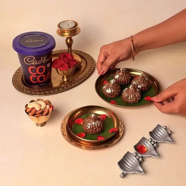 Oats Modak Recipe For Ganpati Bappa With Dry Fruits And Cadbury Cocoa Powder Twist - Served Modaks On Plate
