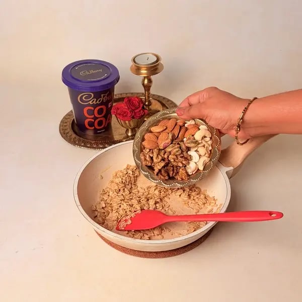 Oats Modak Recipe For Ganpati Bappa With Dry Fruits And Cadbury Cocoa Powder Twist - Roasting Nuts In Pan