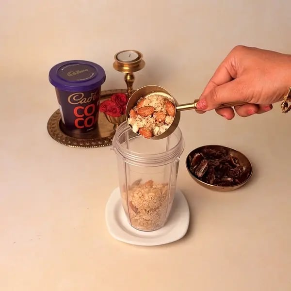 Oats Modak Recipe For Ganpati Bappa With Dry Fruits And Cadbury Cocoa Powder Twist - Blending Roasted Mixture