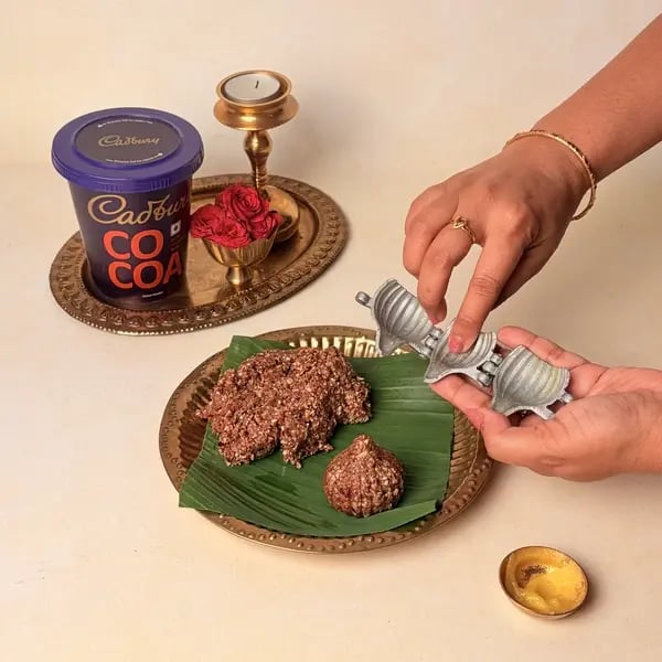 Oats Modak Recipe For Ganpati Bappa With Dry Fruits And Cadbury Cocoa Powder Twist - Greasing Modak Mould