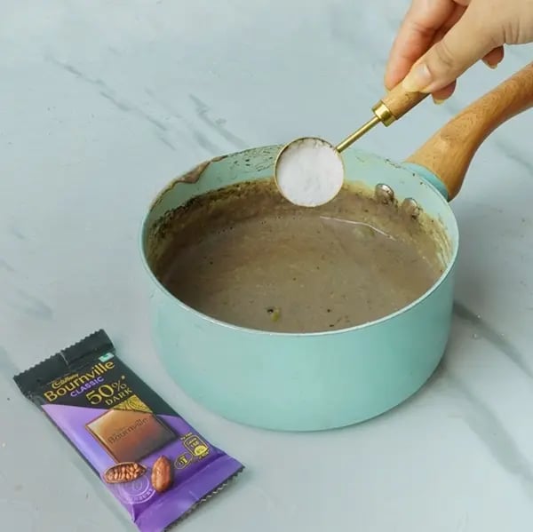 Oreo And Bournville Greek Yogurt Phirni Recipe - Stirring Sweet Mixture