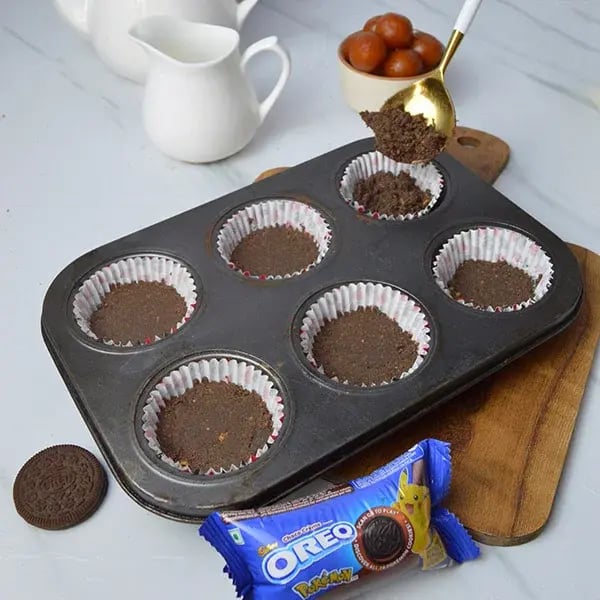 Oreo Crust Gulab Jamun Cheesecake - All cupcake molds and firmly press it