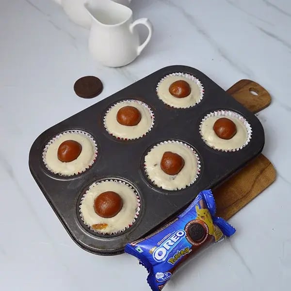 Oreo Crust Gulab Jamun Cheesecake - Place one gulab jamun in the middle of each cup