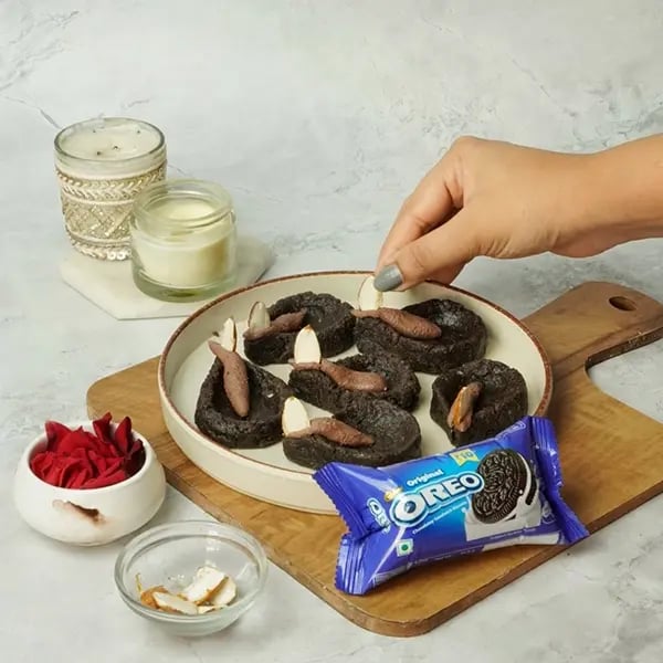 Oreo Diya Sweet For Diwali-Cut the almond in half and place it