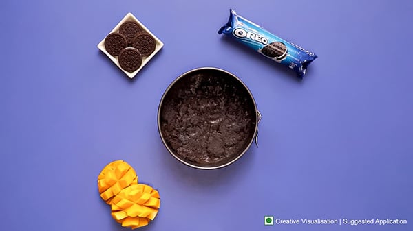 Oreo Mango Cheesecake Recipe - Pressing Mixture Evenly