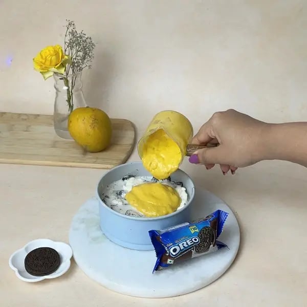 Oreo Mango Icecream Cake - Pouring Mango Puree
