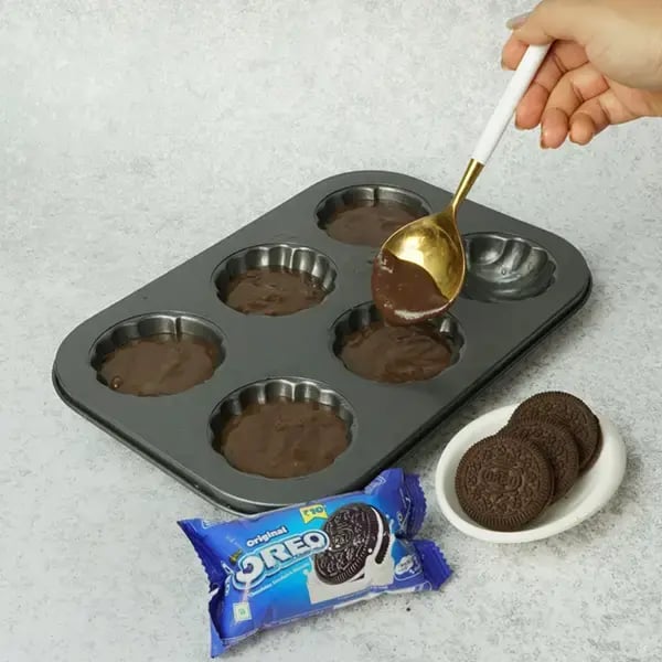 Oreo Mocha Pistachio Madeleines Cupcake - Pour batter into madeleine-shaped cupcake molds