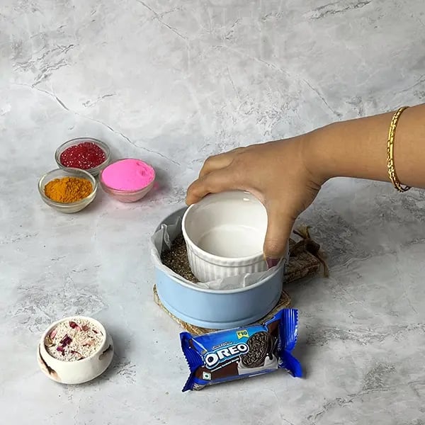 Oreo No-Bake Thandai Cheesecake-Gently press the crumbs evenly