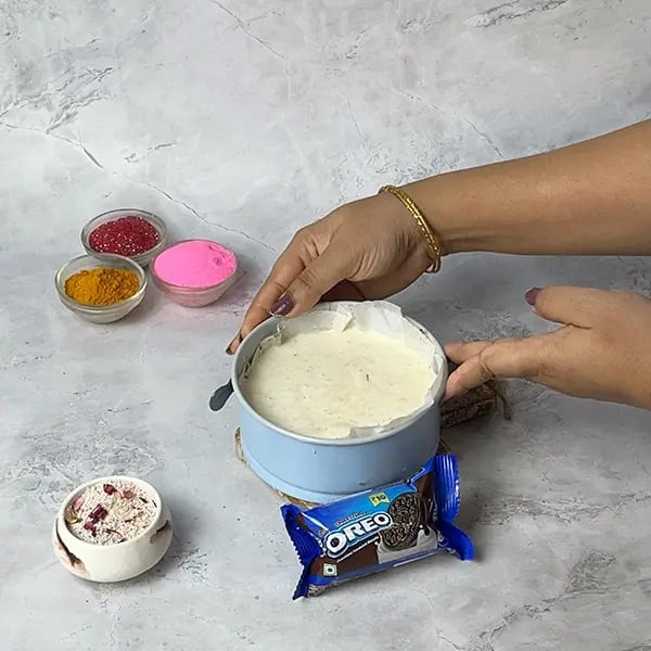 Oreo No-Bake Thandai Cheesecake-Tap the pan on the counter a few times