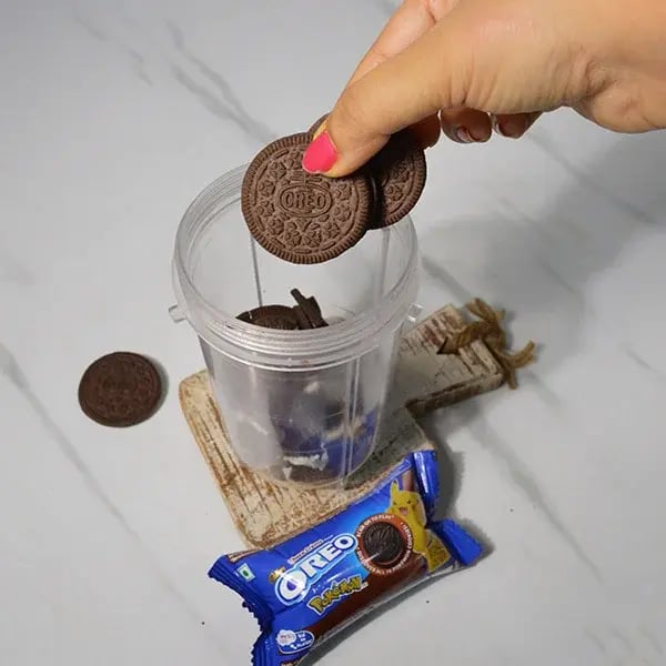 Oreo Rangoli Themed Truffle Cake - Take Oreo cookies in a blending jar