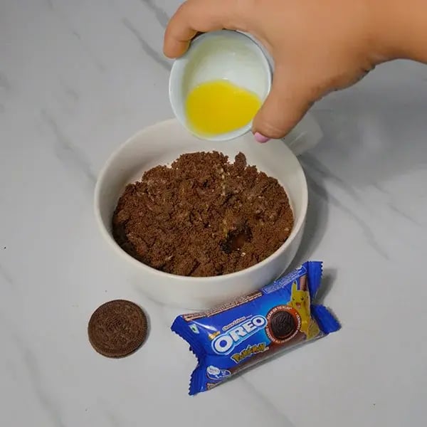 Oreo Rangoli Themed Truffle Cake - Transfer this powder to a bowl