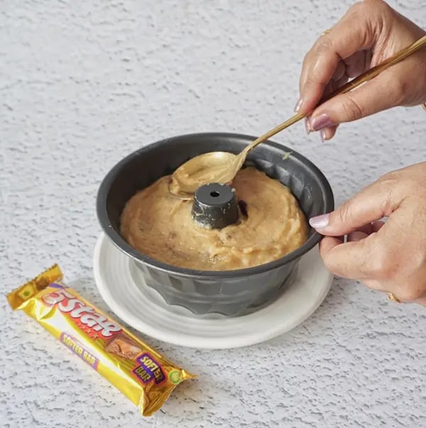 Peanut Butter Cake with Dried Cranberries and 5 Star Chunks-Pour the batter into the pan