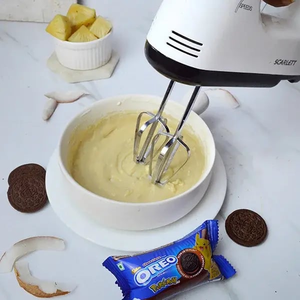 Pina Colada Cheesecake with Oreo Crust - Beat the cream cheese