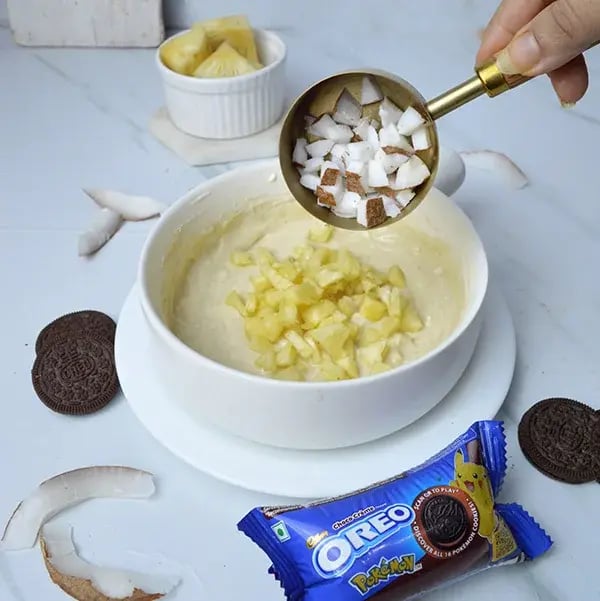 Pina Colada Cheesecake with Oreo Crust - Add coconut chunks