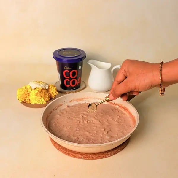 Rice Payasam With Cadbury Cocoa Powder For Onam - Stirring Payasam Cardamom