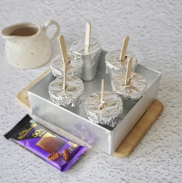 Rose flavored Kulfi with Dry fruit and Bournville Chocolate-Cover the molds with foil or lids