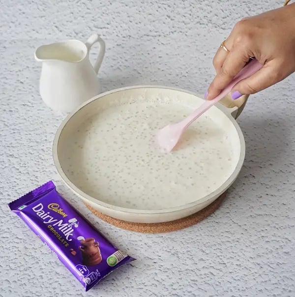 Sabudana Kheer Festive Dessert with Pistachios and Dairy Milk Chocolate Crunch- Reduce the heat and simmer until the mixture