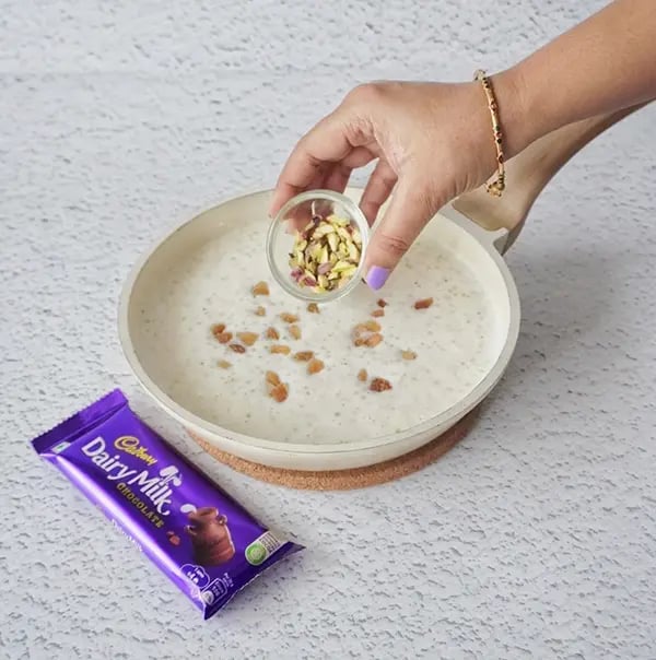 Sabudana Kheer Festive Dessert with Pistachios and Dairy Milk Chocolate Crunch-Stir in the chopped, roasted pistachios