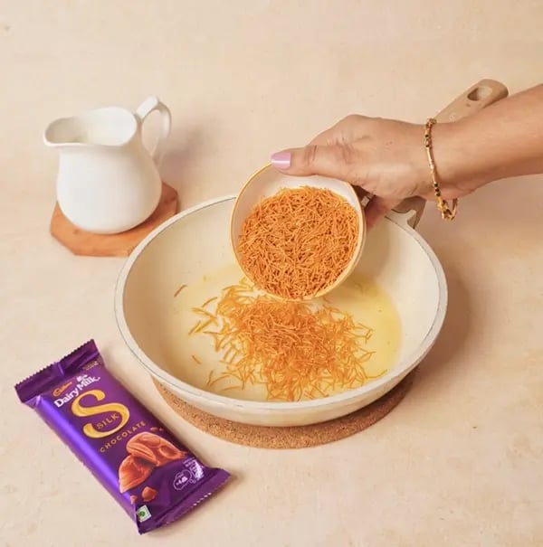 Seviyan Kheer with Cadbury Dairy Milk Silk -Heat ghee in a pan over