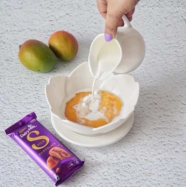 Silk Chocolate Mango Falooda With Sabja Seeds Recipe - Mango Milk Being Whisked