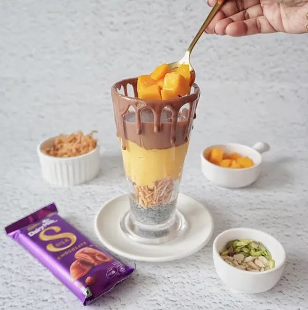 Silk Chocolate Mango Falooda with Sabja Seeds-Top the melted chocolate with a spoonful of fresh mango cubes
