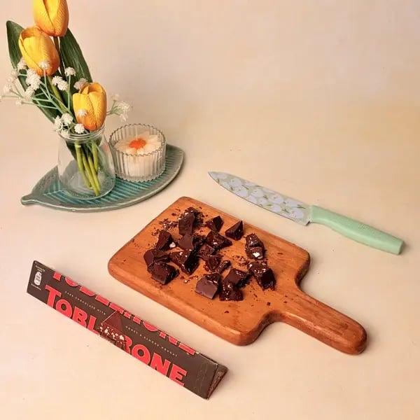 Singhare Ka Halwa Truffles: A Vrat-Friendly Navratri Sweet With A Toblerone Chocolate Center - Cutting Chocolate Pieces