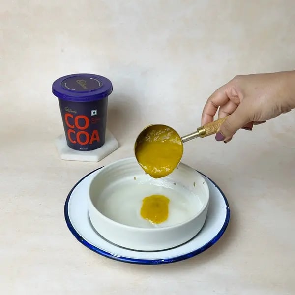 Softest Eggless Cocoa Mango Cake - Adding Mango Puree