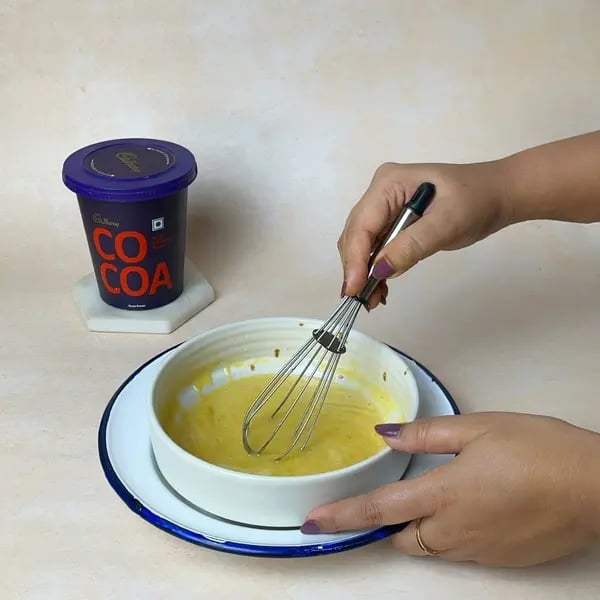 Softest Eggless Cocoa Mango Cake - Mixing Batter