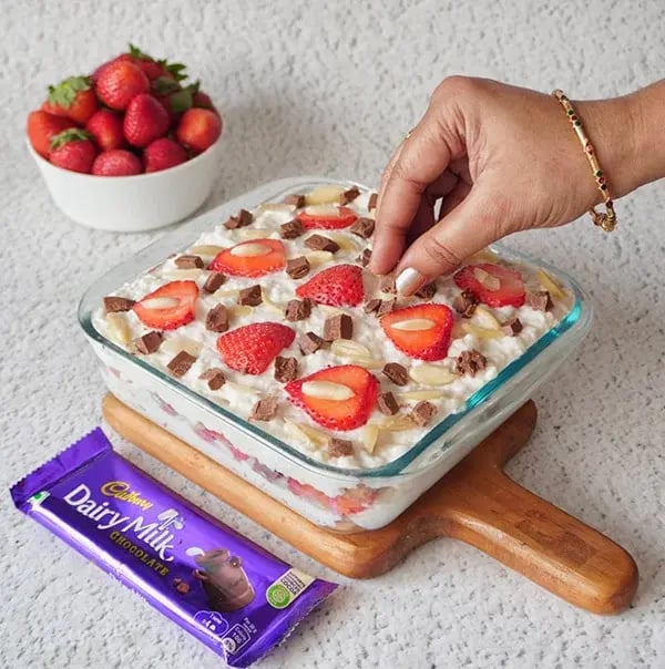 Strawberry Icebox Cake with Almonds and Dairy Milk - Final topping of strawberries