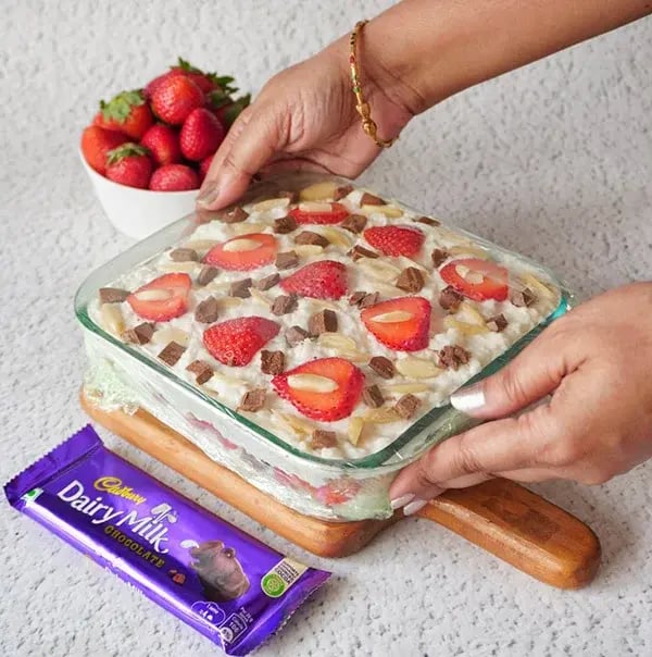 Strawberry Icebox Cake with Almonds and Dairy Milk - Cover the cake with cling wrap